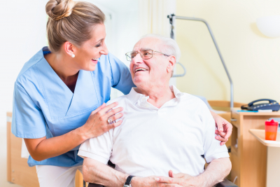senior man and his caregiver in a nursing home